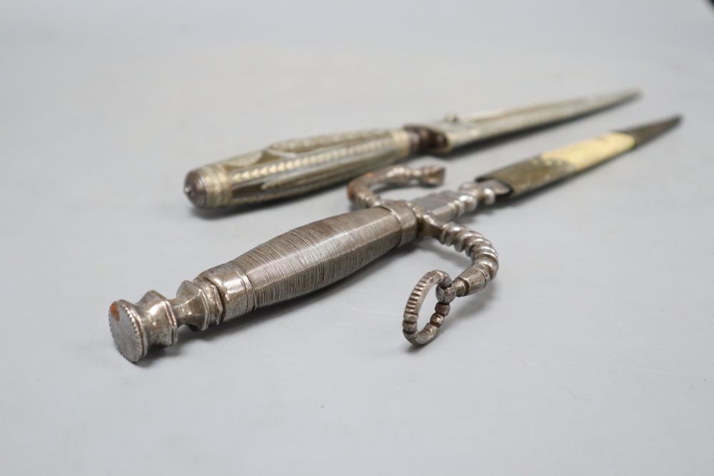 An Italian 19th century dagger stiletto, engraved silver mounts, horn grip, brass sheath sides with inscription Di Coltello Perira Chi